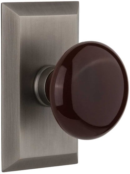 New York Rosette Door Set with Brown Porcelain Knobs in Antique Pewter.